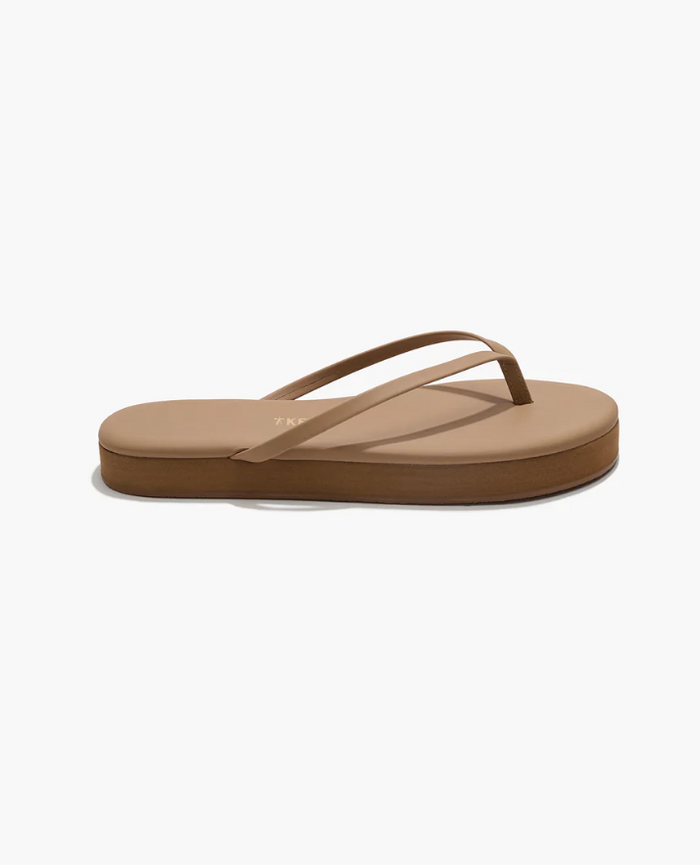 Beige sandal on a white background