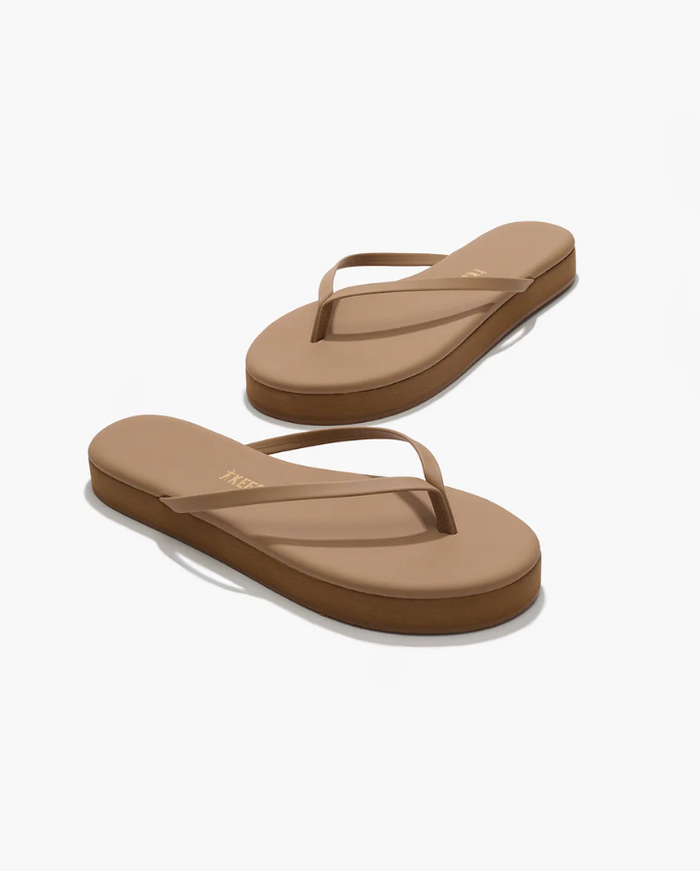 Pair of brown sandals on a white background