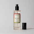 Votivo Red Currant fragrance bottle on a light gray background