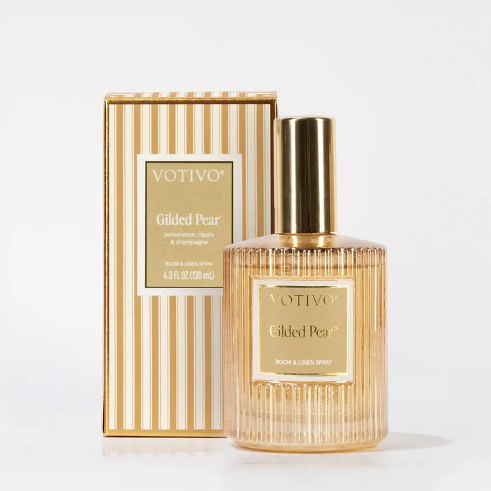 Votivo Gilded Pear perfume bottle and packaging on a white background