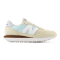 Beige sneaker with a light blue pattern on a white background