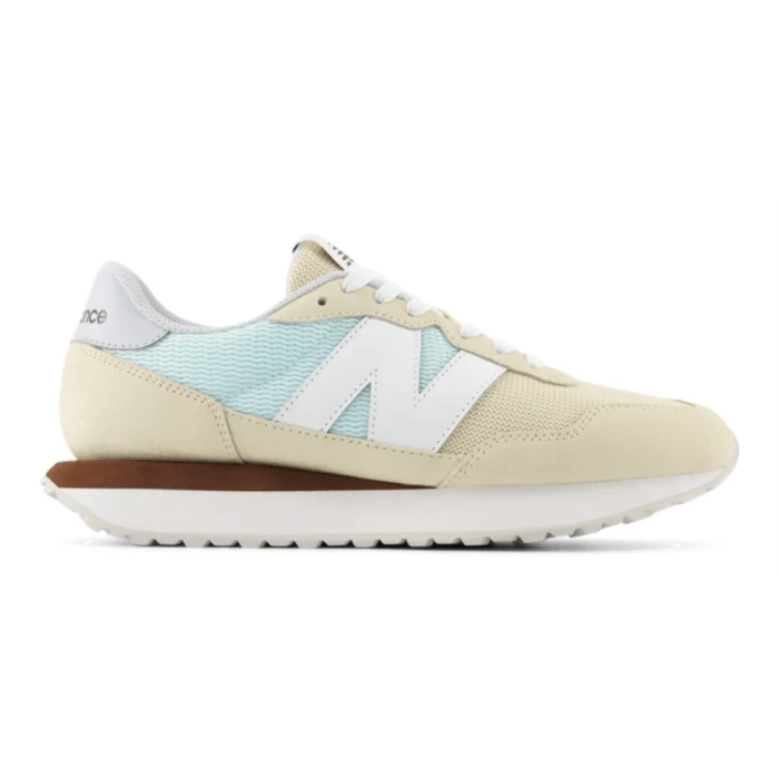 Beige sneaker with a light blue pattern on a white background