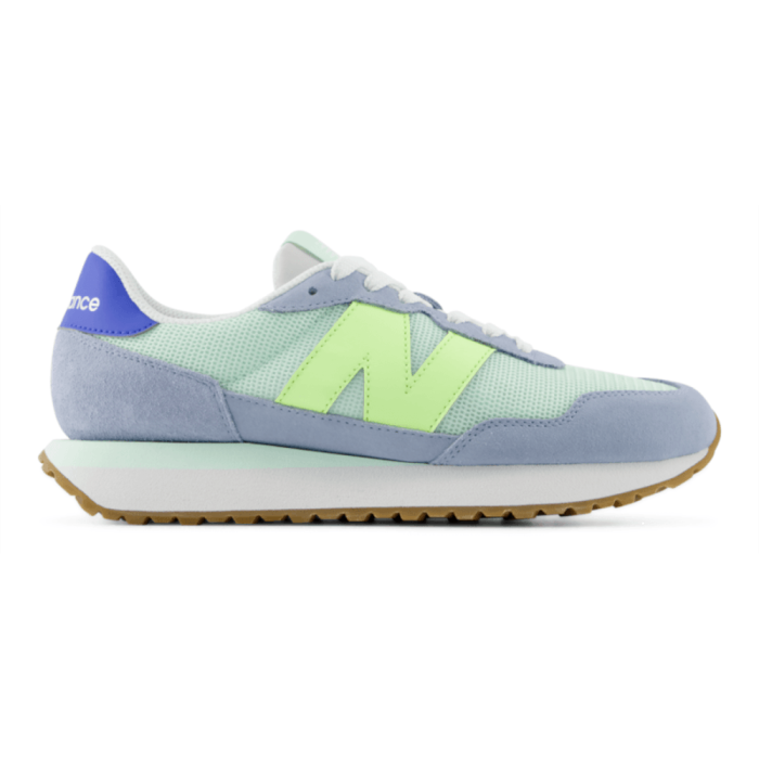 Light blue and green sneaker with New Balance logo on a white background