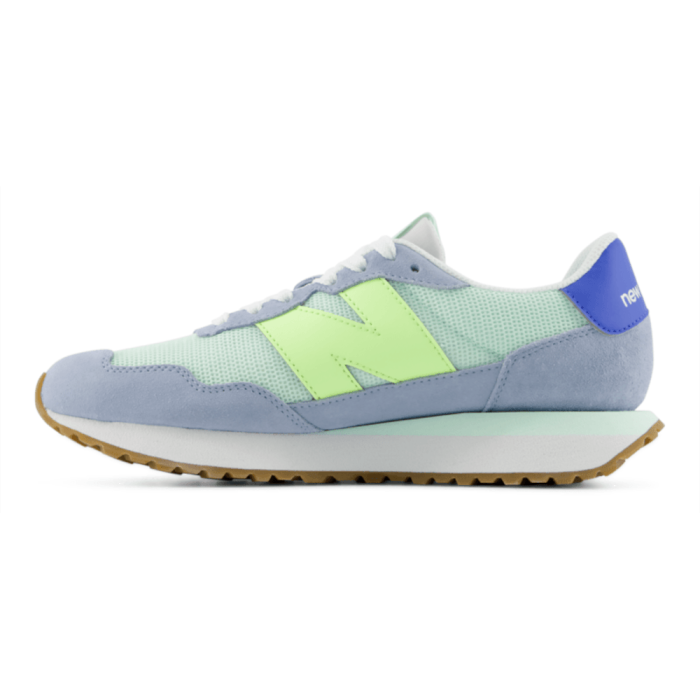 Light blue sneaker with green accents on a white background
