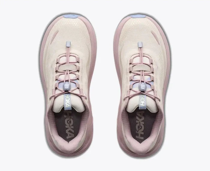 A pair of HOKA hiking shoes shown from a top-down view, featuring a light cream mesh upper with dusty pink overlays, matching pink laces, and a light blue accent near the lace loop.