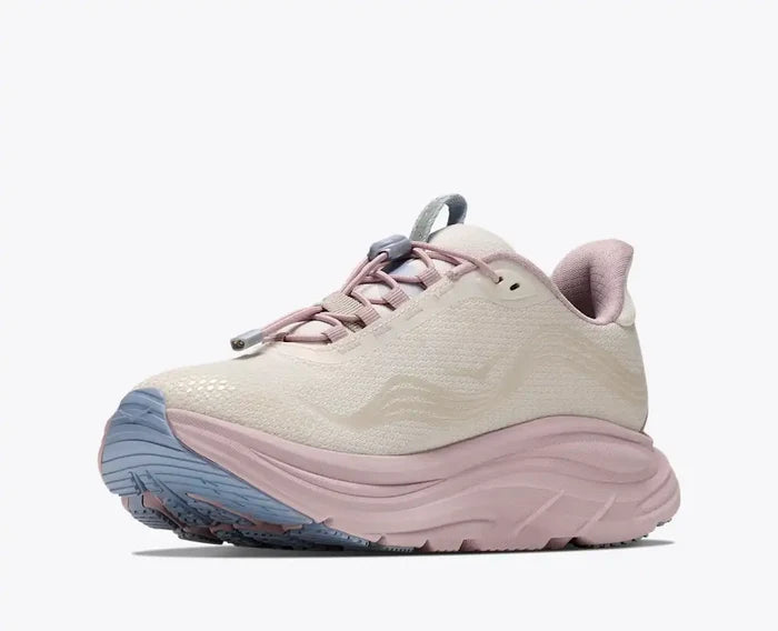 A single athletic sneaker shown in a side profile view against a clean white background. The shoe features a textured off-white upper, a thick chunky light pink midsole, a dusty pink collar lining, and a blue-gray outsole.