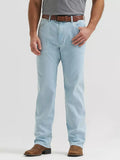 A person wearing light-wash blue jeans with a brown belt and brown boots, shown from the waist down against a plain light gray studio background.