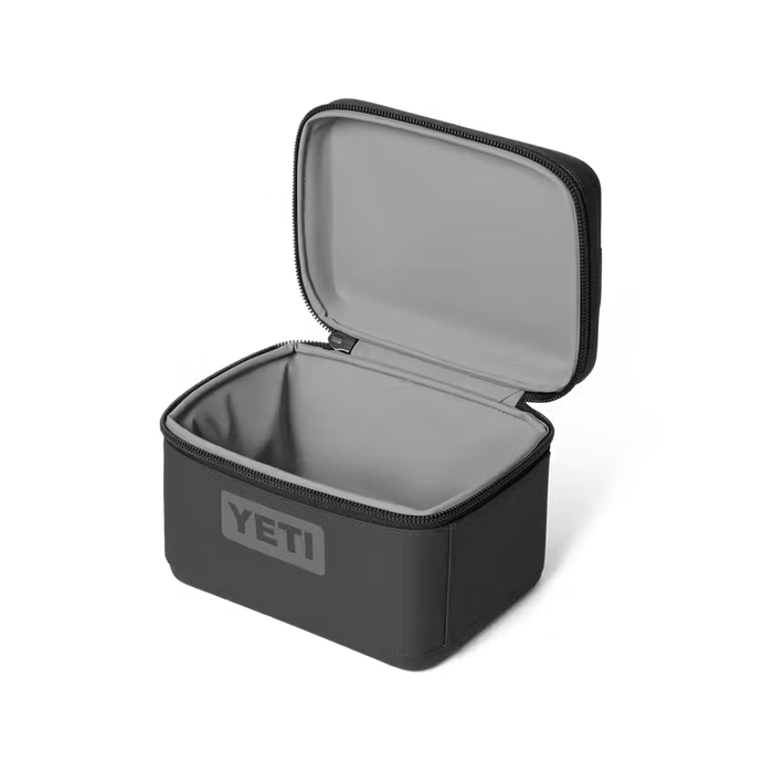 Black YETI lunch box with open lid on a white background
